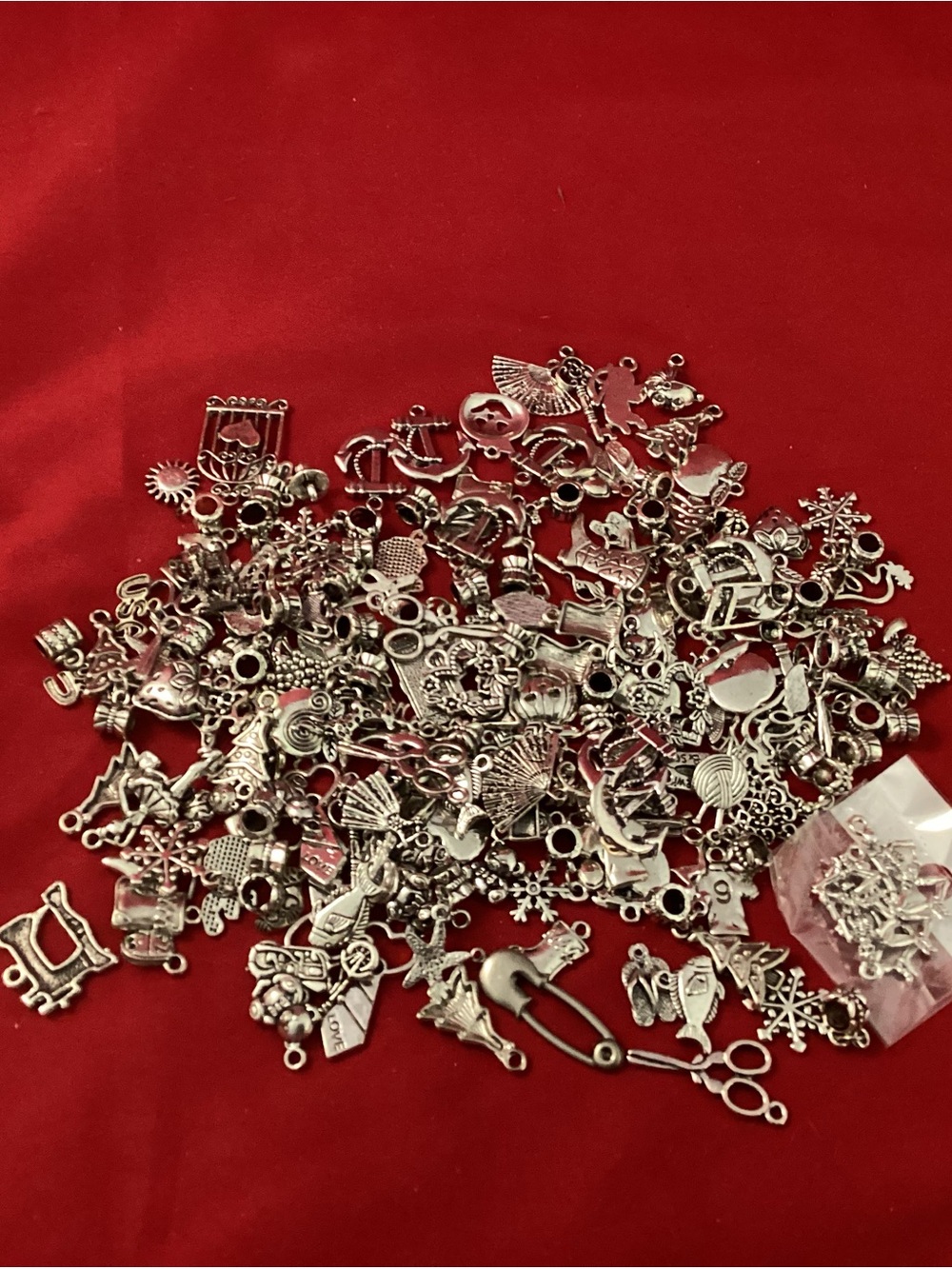 238 grams of Silver Tone Assorted Charms for jewelry makingAdd